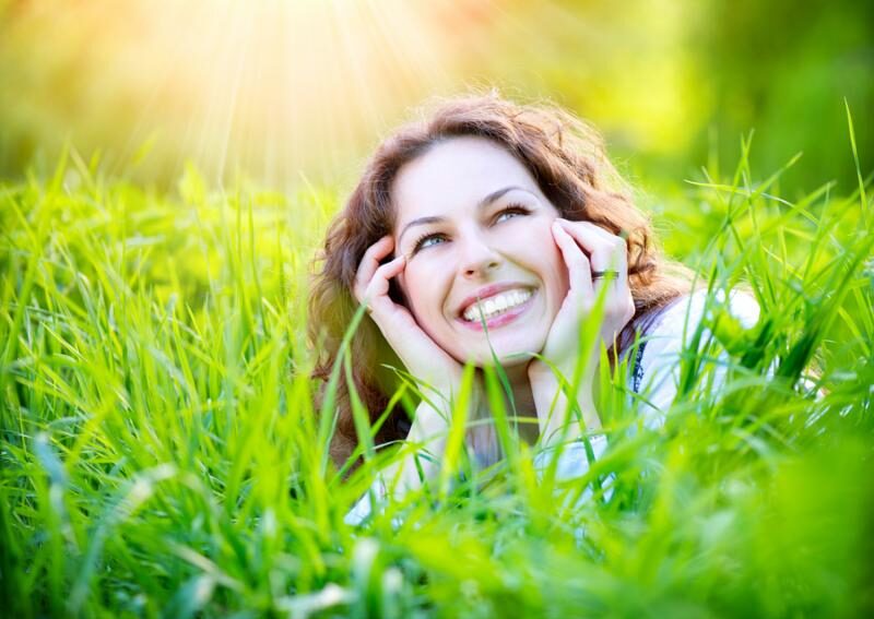 woman smiling in the grass